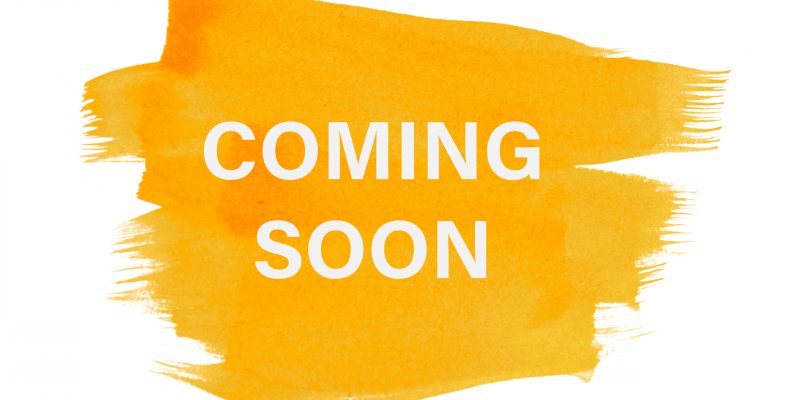 Coming soon on yellow paint background, isolated on white. Advertising banner concept.